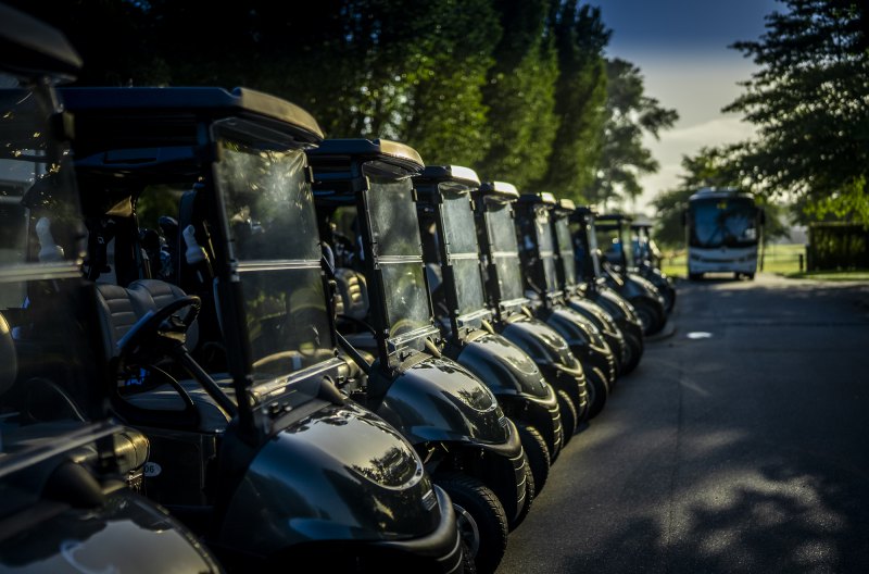 9 holes of golf including a cart.